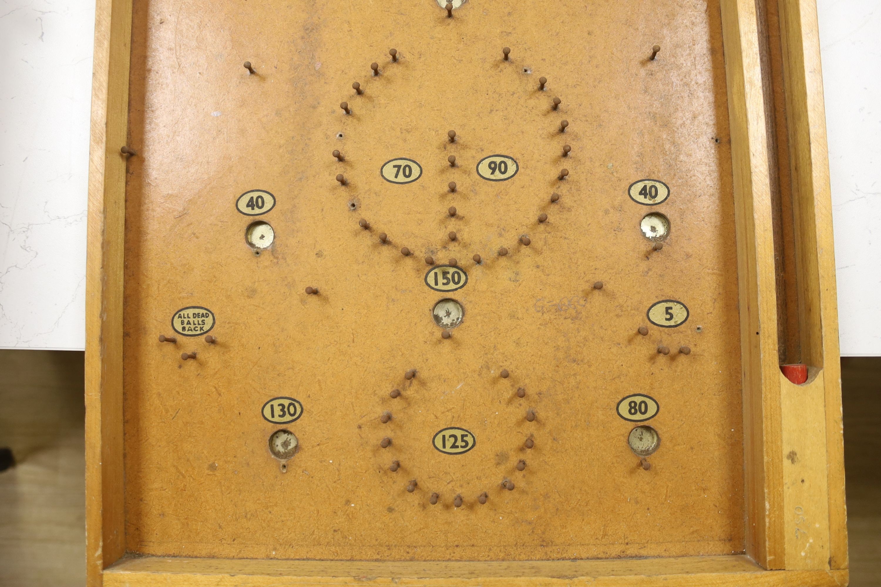A vintage bird scarer and a Chad Valley bagatelle board